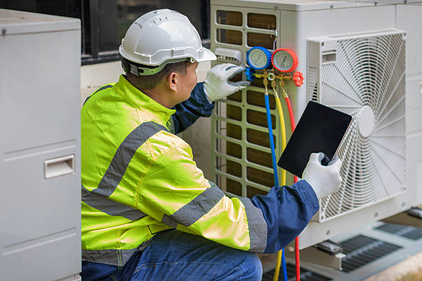 Professional Heat Pump Repair technician working in Clay, AL